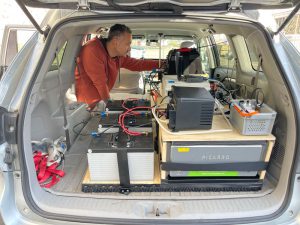 image of a man working with research equipment in a van