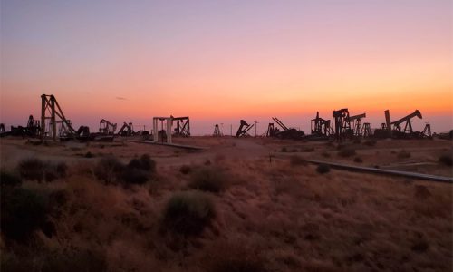 oil well field at sunset